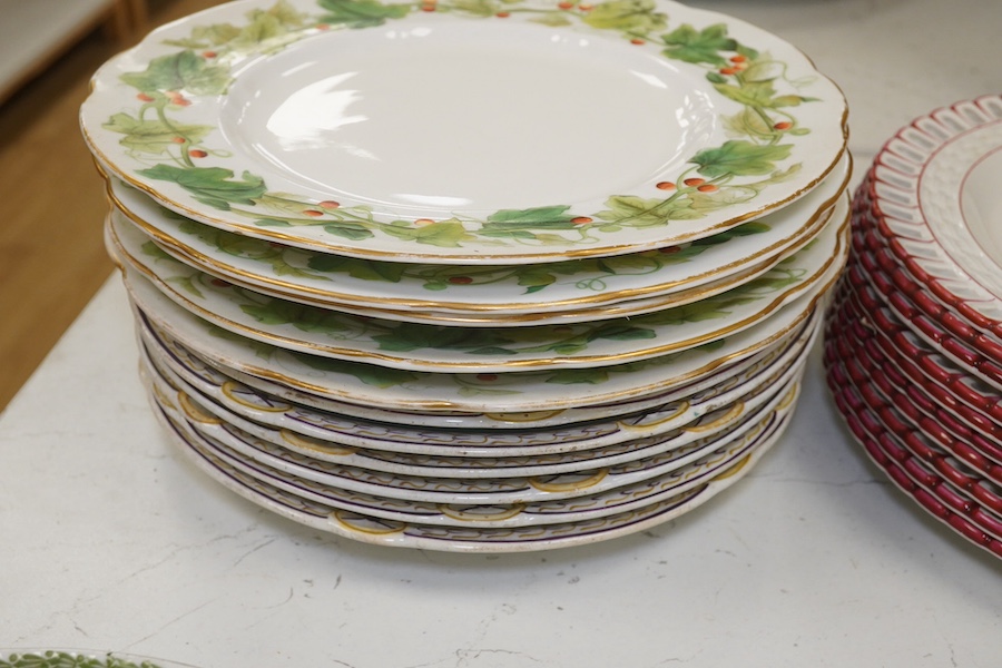 Ten French Luneville floral plates, a hand painted basket edged plate and various part dinner service plates, 24cm in diameter. Condition - mostly fair to good